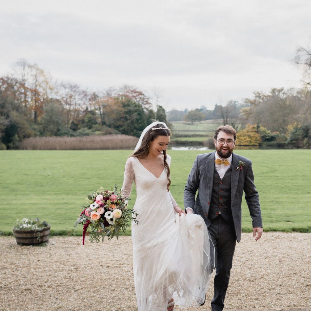 Bride and groom stood outside wedding venue in Somerset 