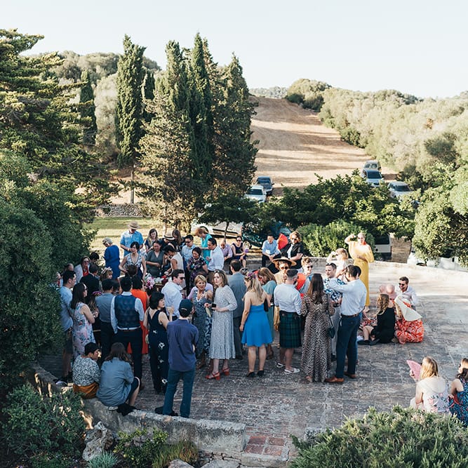 Wedding party gather outdoors in Menorca