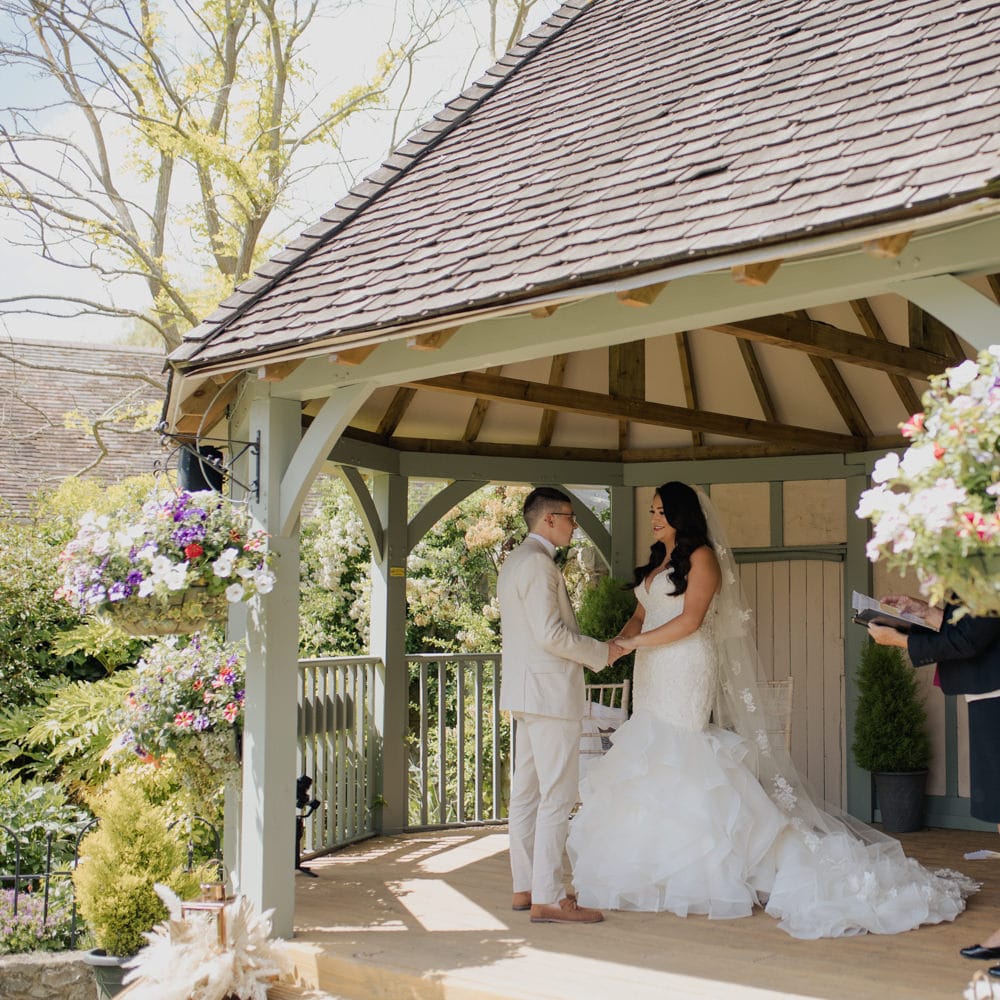 Civil wedding ceremony at Cooling Castle Barn with bride in a mermaid wedding dress and appliqué wedding dress