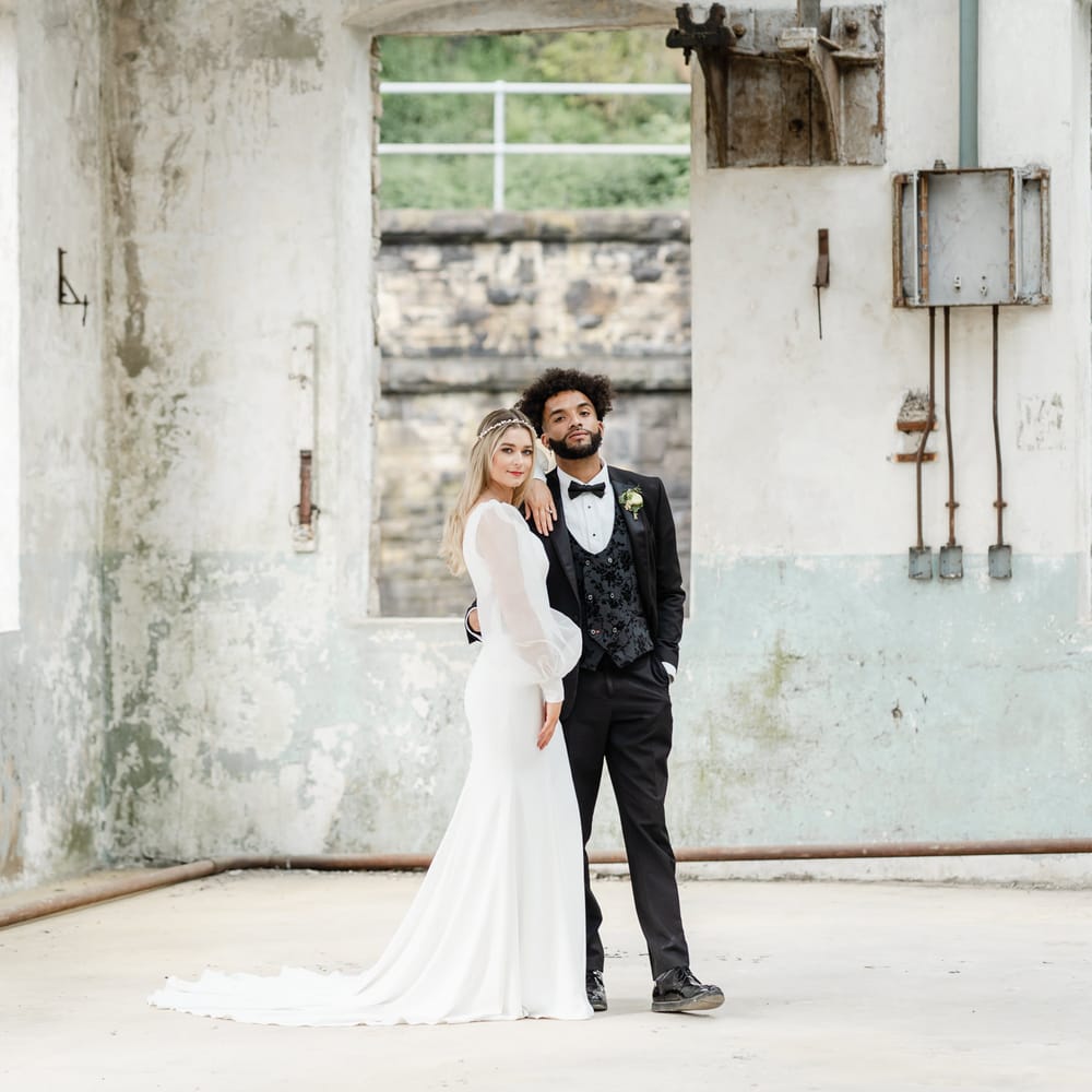 Stylish bride and groom in industrial wedding venue, Torr Vale Mill in Derbyshire 