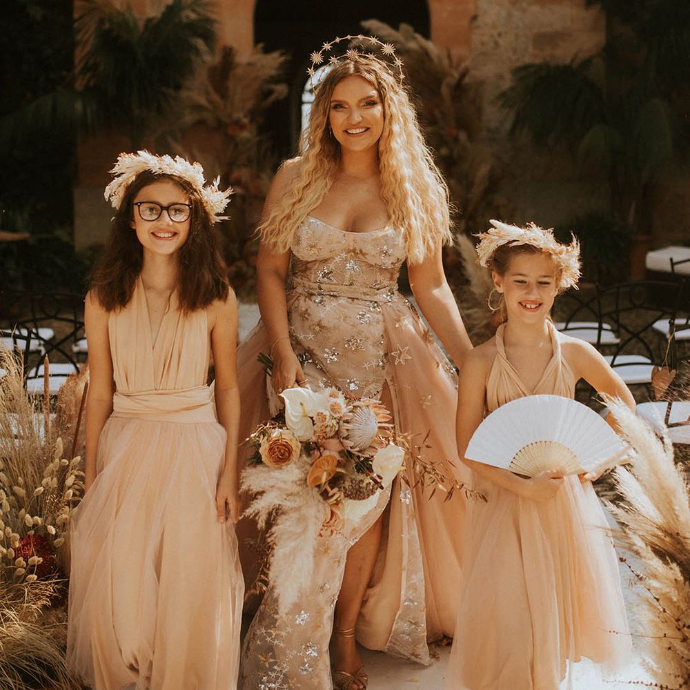Bride wears celestial wedding gown complete with star crown on her wedding day
