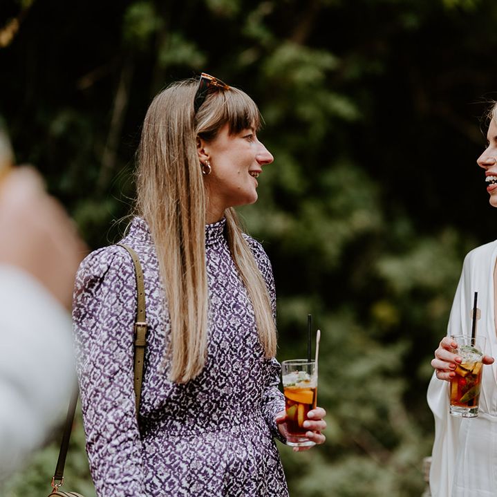 Bride looks toward friend on her wedding day