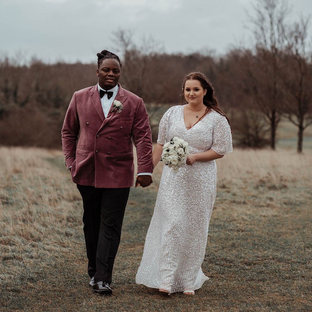 Bride & groom stand outside on their wedding day