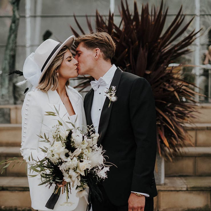 Bride and groom kiss each other on their wedding day 