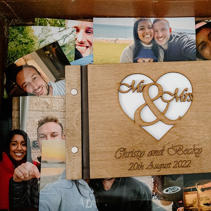 Collection of photos of the couple with a personalised plaque 