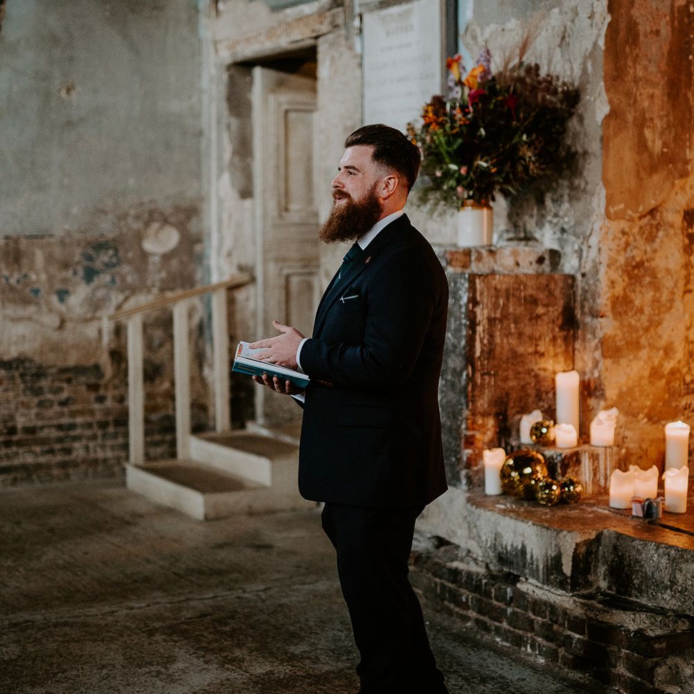 Wedding guest does reading at the front of Chapel  wedding venue in London
