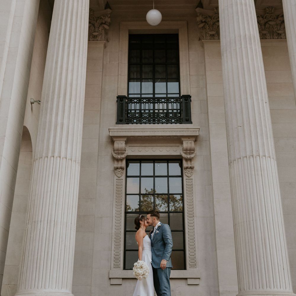 Bride and groom kissing at Old Marylebone Town Hall wedding