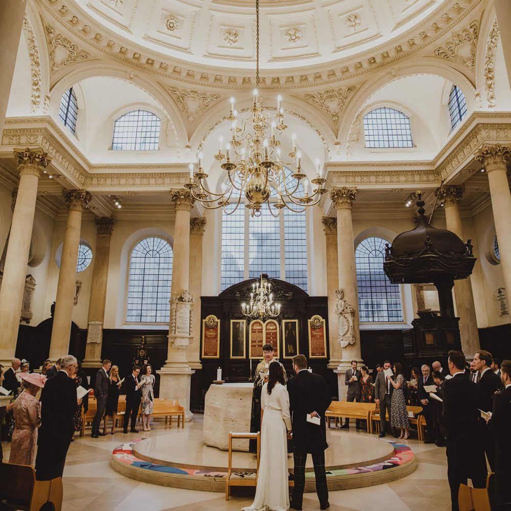 St Stephen Walbrook & The Institute of Contemporary Arts wedding with high ceiling and stunning chandelier 