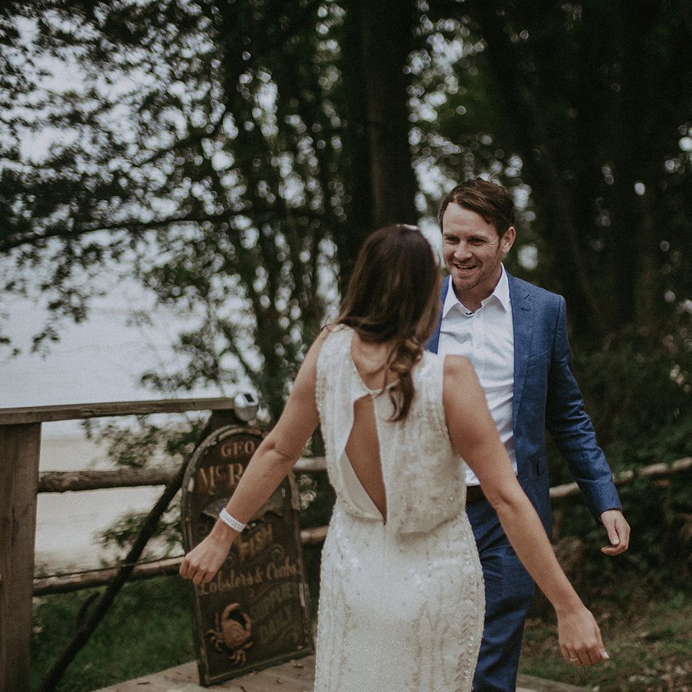 Groom sees bride for the first time during first look moment on their wedding day
