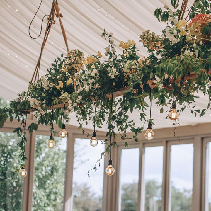 Hanging foliage and light installation above tables at Trevenna Barns 