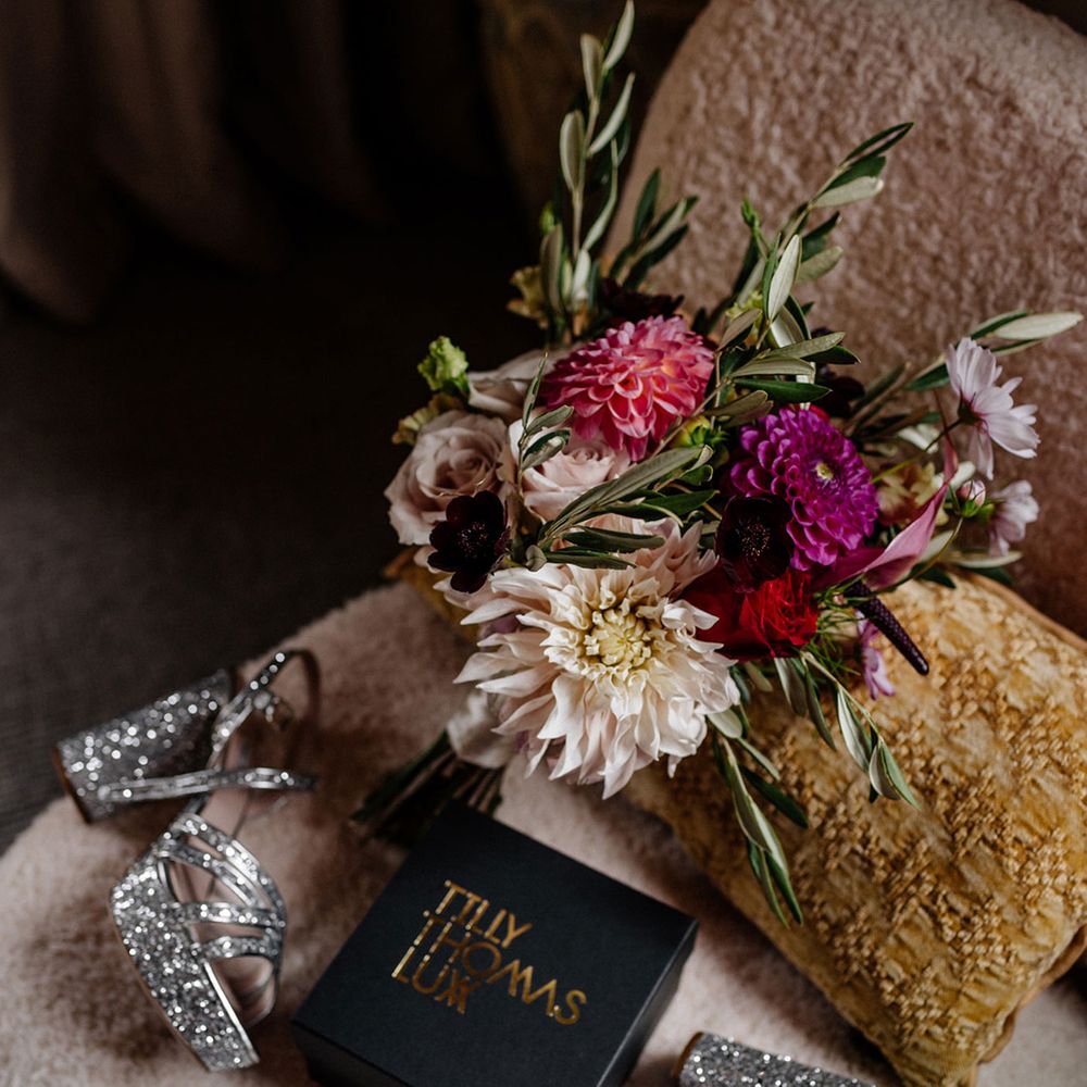 Sparkly silver platform Miu Miu platform wedding shoes and pink bridal bouquet 