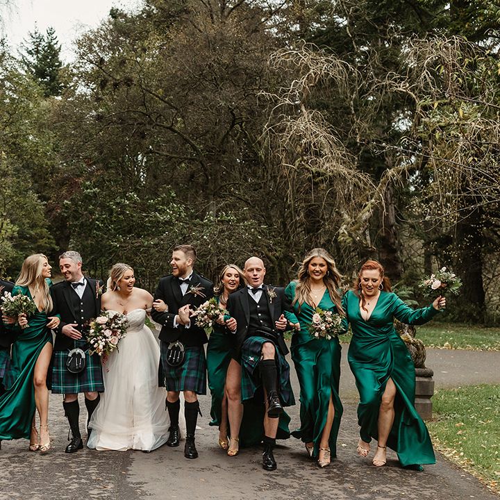 Wedding party look stunning with bride and groom, groomsmen and bridesmaids with a green theme 