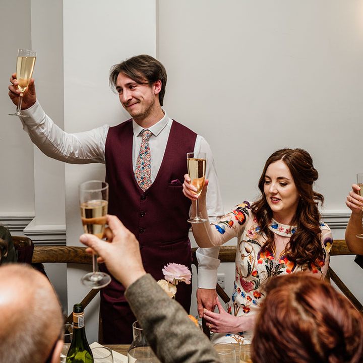 Everyone raises a toast while the groom gives his speech 