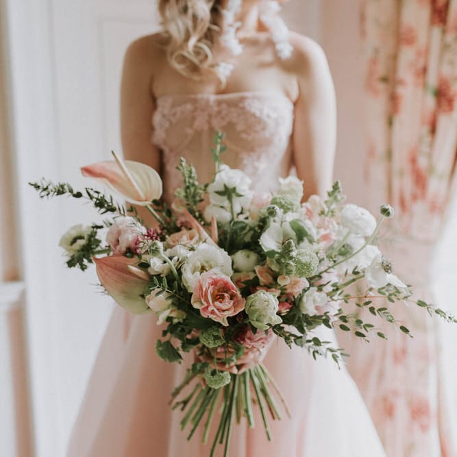 romantic pink, white and green wedding bouquet with anthuriums, anemones and peony tulips 