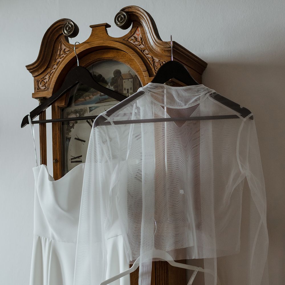 The bride's Jessica Bennett wedding dress with veil and mesh overlay top 