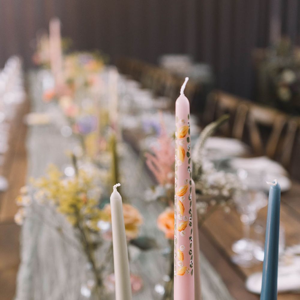 Painted pink wedding candle decoration in pastel coloured candleholder 