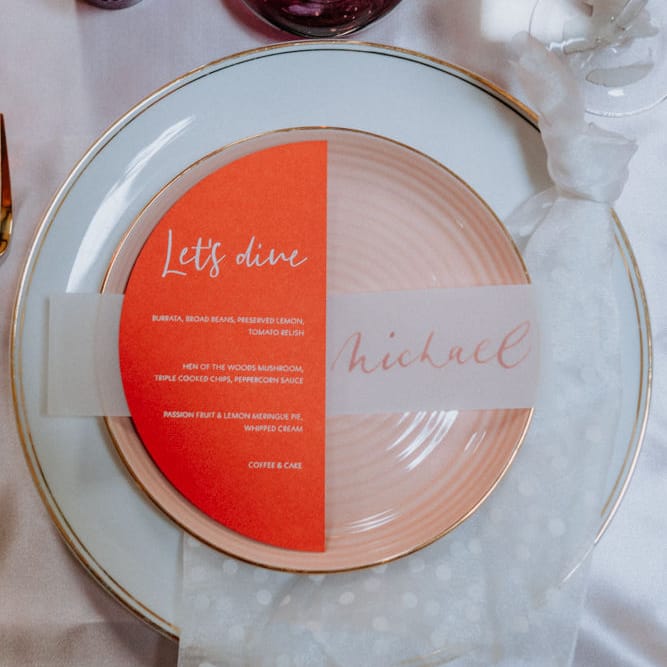 Semi circle wedding menu at place setting 