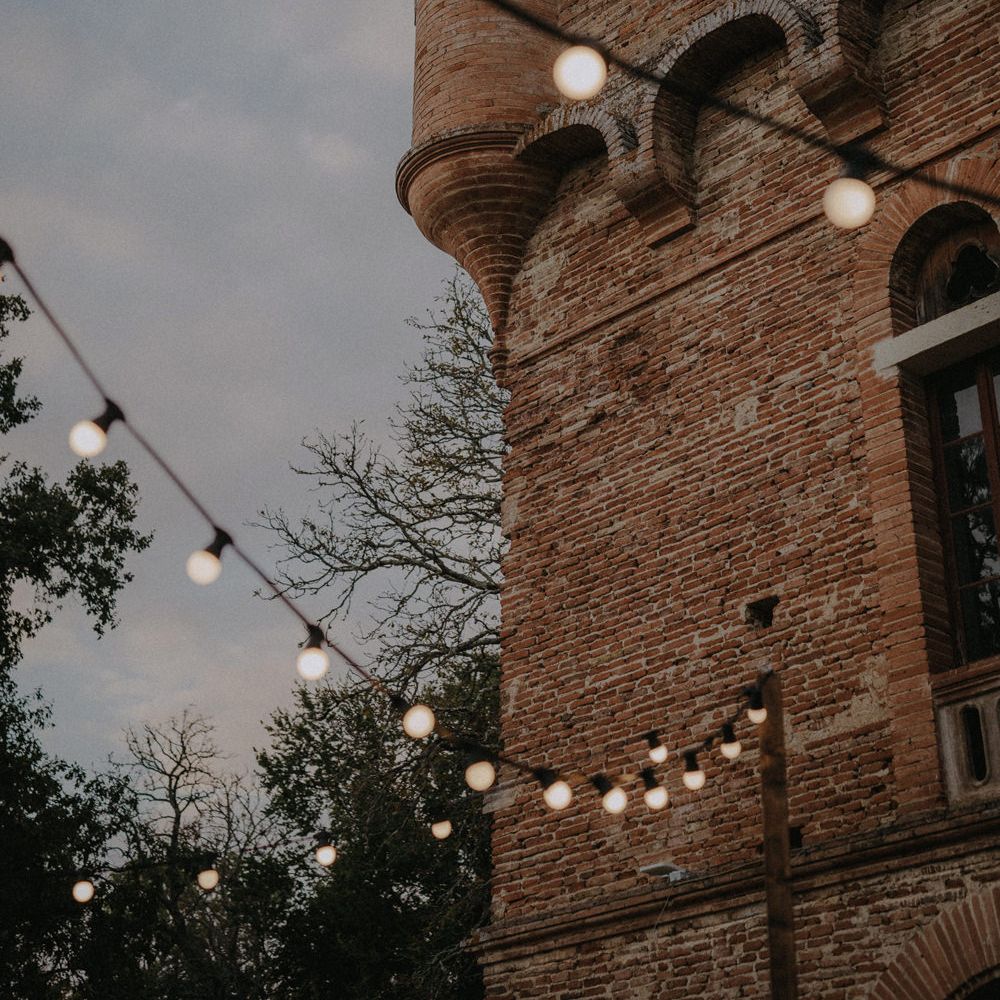 Festoon light wedding decor at French castle wedding 