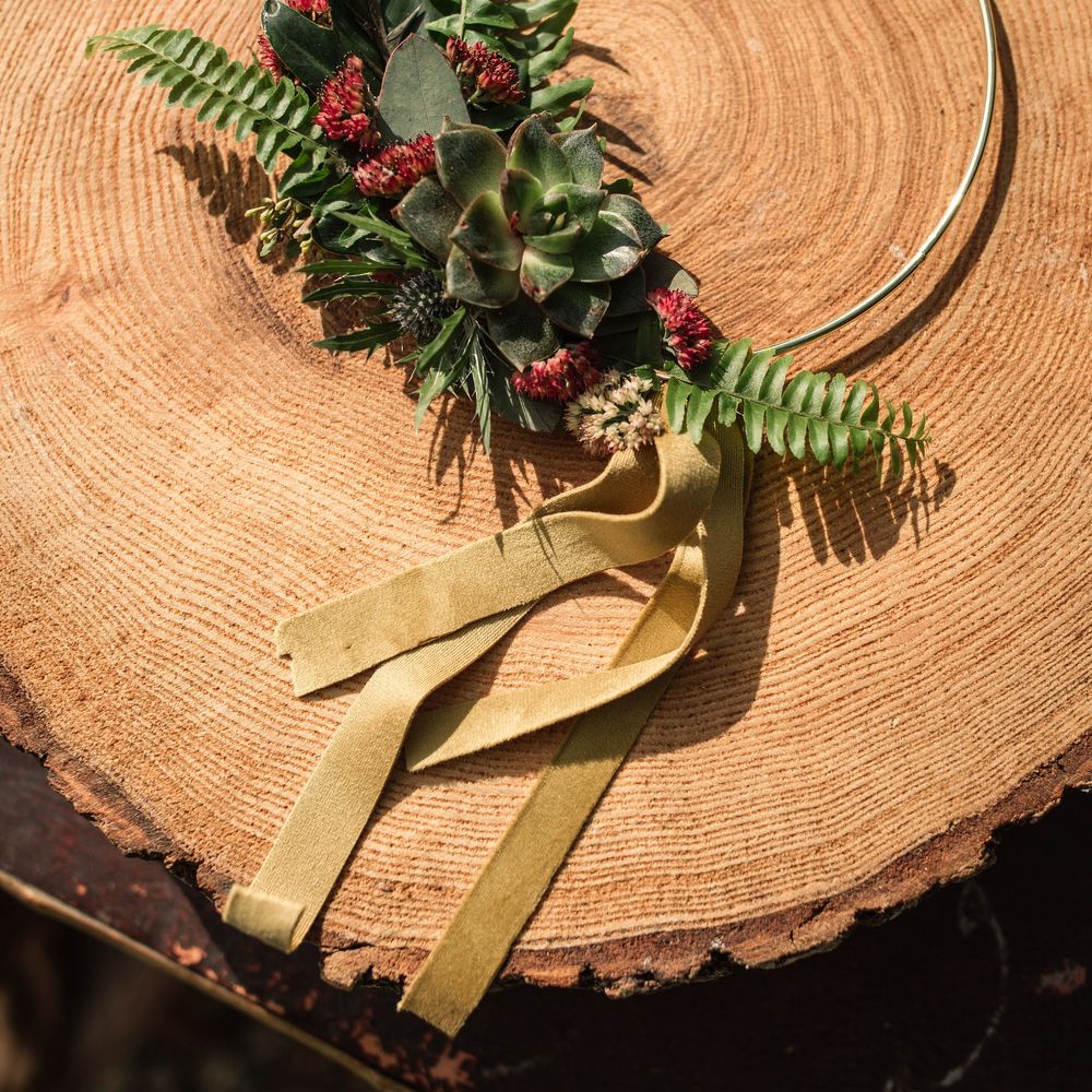 Floral decor on tree with golden ribbon