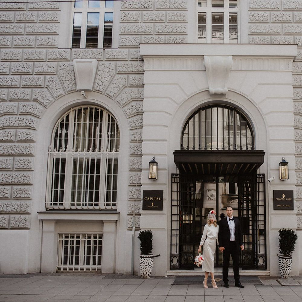 Bride and groom standing outside Amadria Park Hotel Capital Ballroom