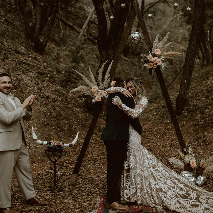 Bride & groom hug during reception 
