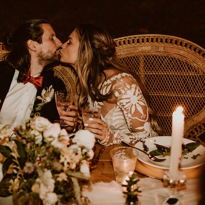 Bride & groom kiss during reception