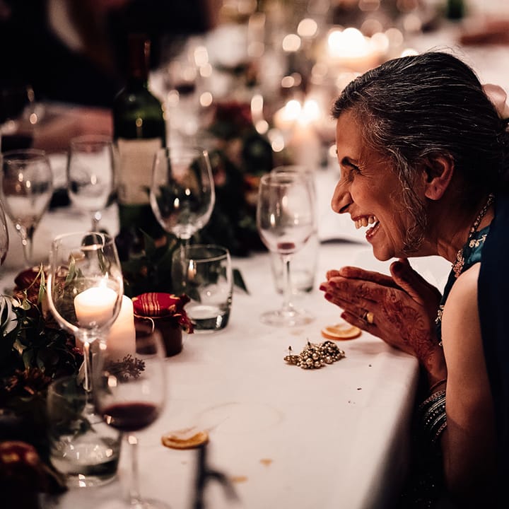 White table cloths, smiles, foilage & smiles at Minley Manor