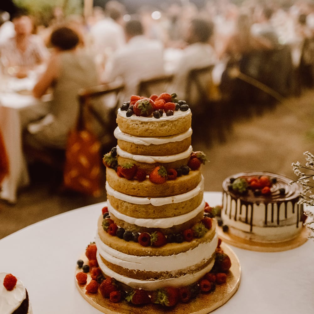 Naked wedding cake with berries