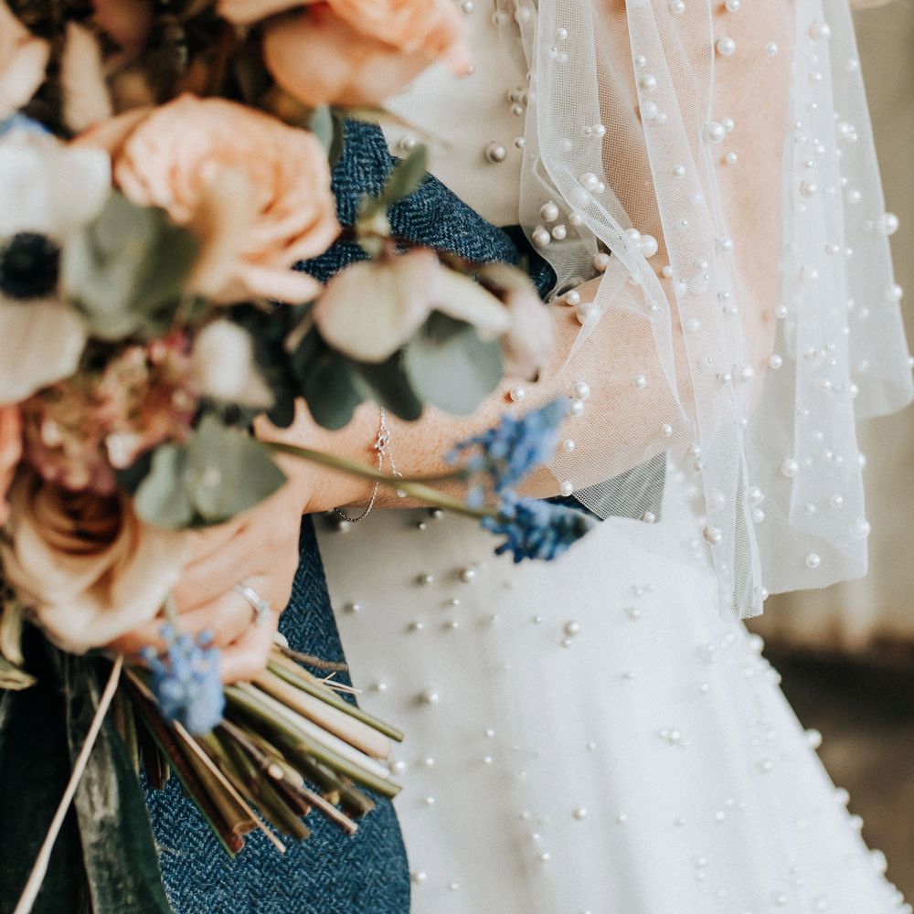 Pearl encrusted mesh sleeves of wedding dress for industrial style wedding