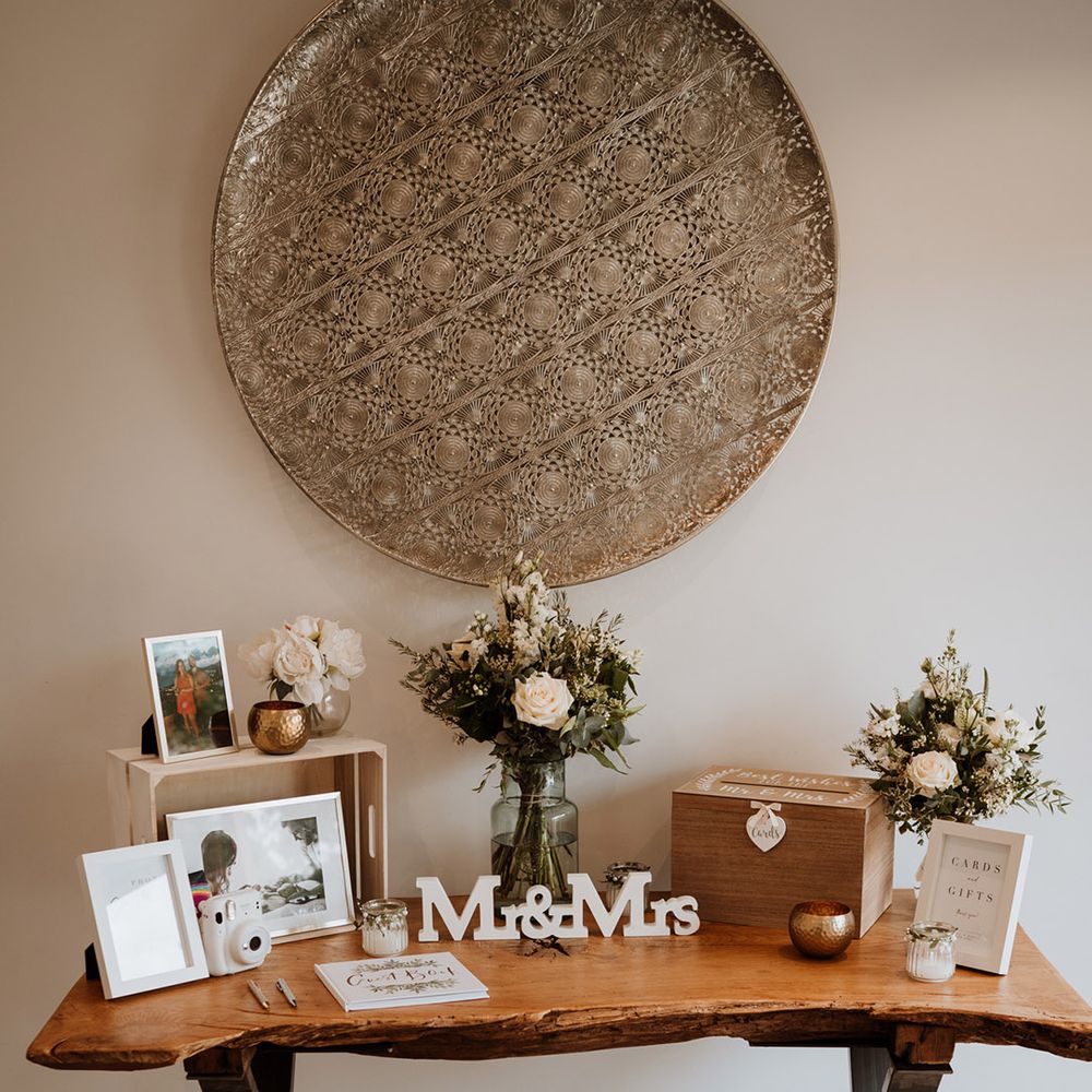 A polaroid guest book with a box for cards and gifts 