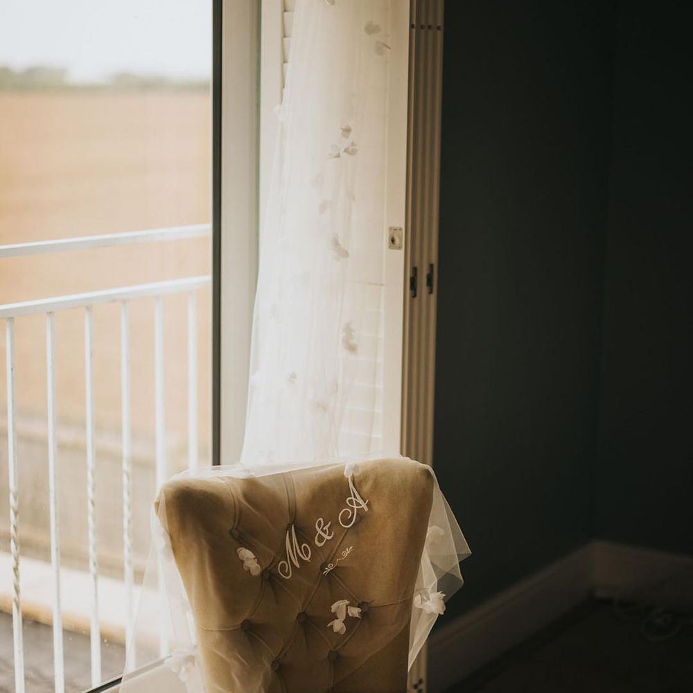 Embroidered veil with the bride and groom's initials and 3D flower detailing