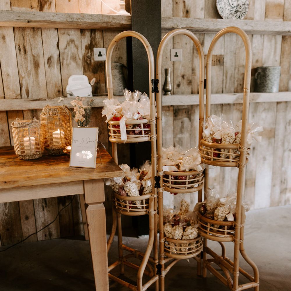 Popcorn and sweetie goody bag station for the wedding guests to help themselves at Hidden River Cabins wedding in Cumbria 