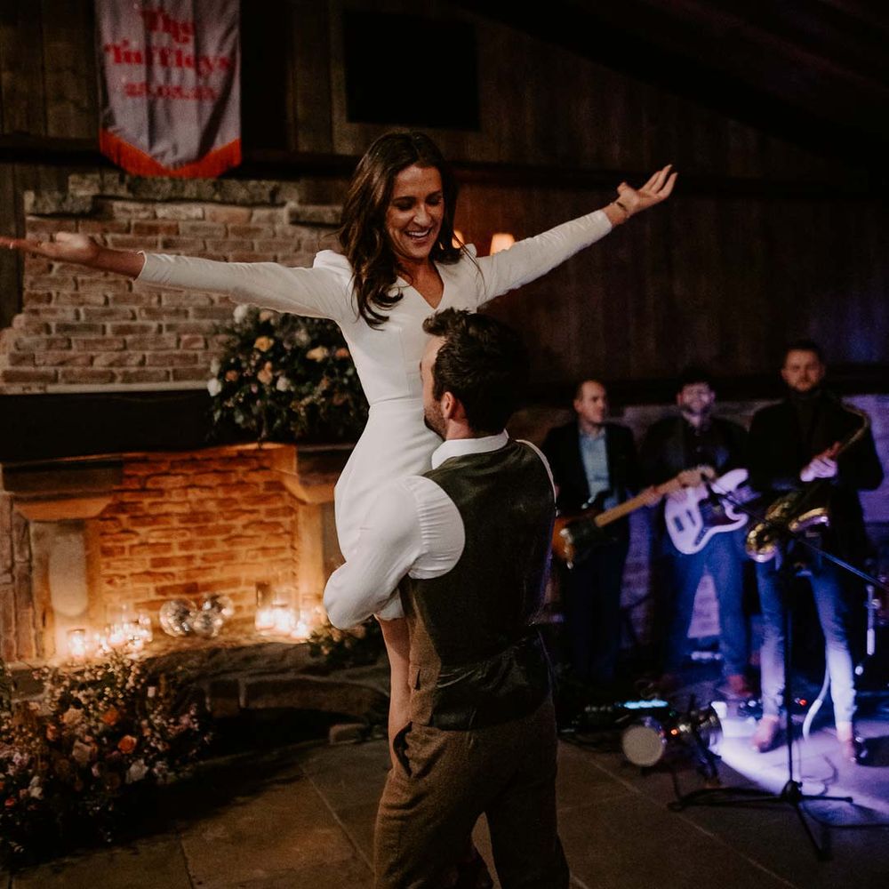 Bride and groom doing wedding choreographed first dance to upbeat first dance wedding song at Willow Marsh Farm Loughborough 