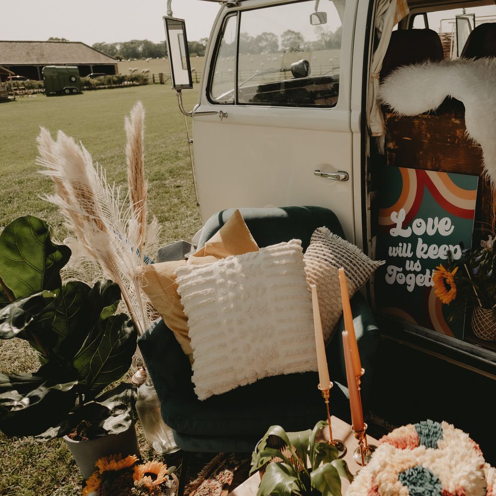 Dried grasses, macrame and faux fur rugs for 70s wedding inspiration in a VW camper van