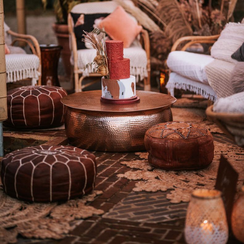 Comfy leather cushion seating at boho wedding reception