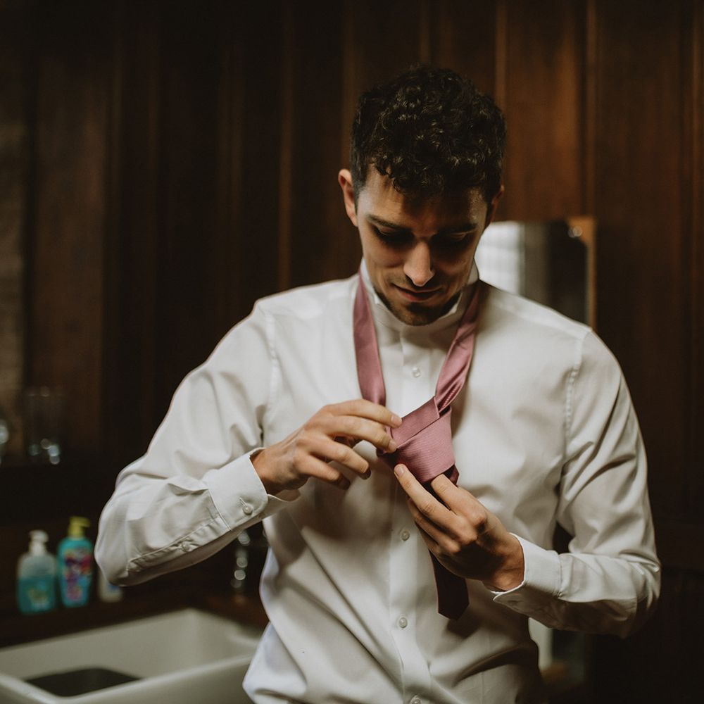 Groom preparations for micro wedding in Church