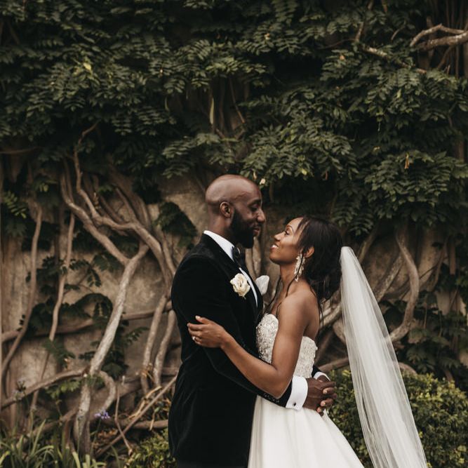 Black bride and groom wedding photography by Hajley with the bride in a Oleg Cassini wedding dress 