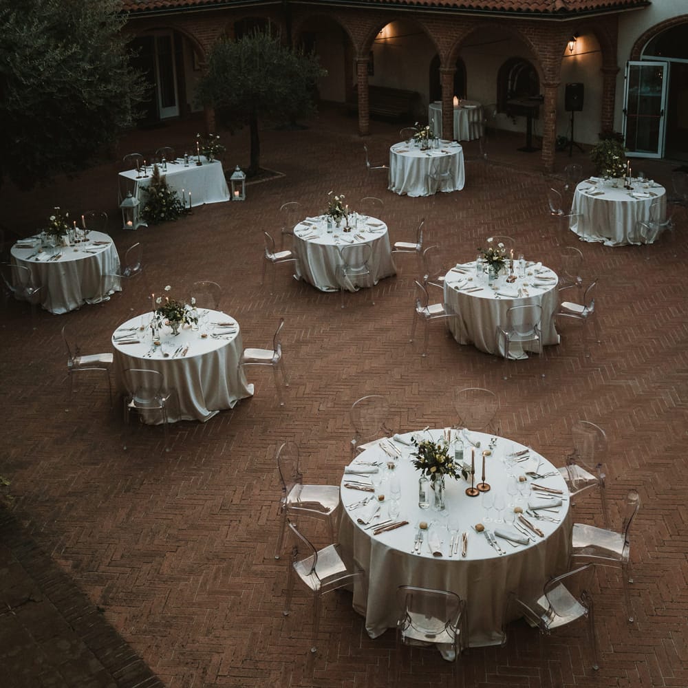 Aerial view of a socially distanced wedding reception at Cella Grande, Lake Viverone, Italy  