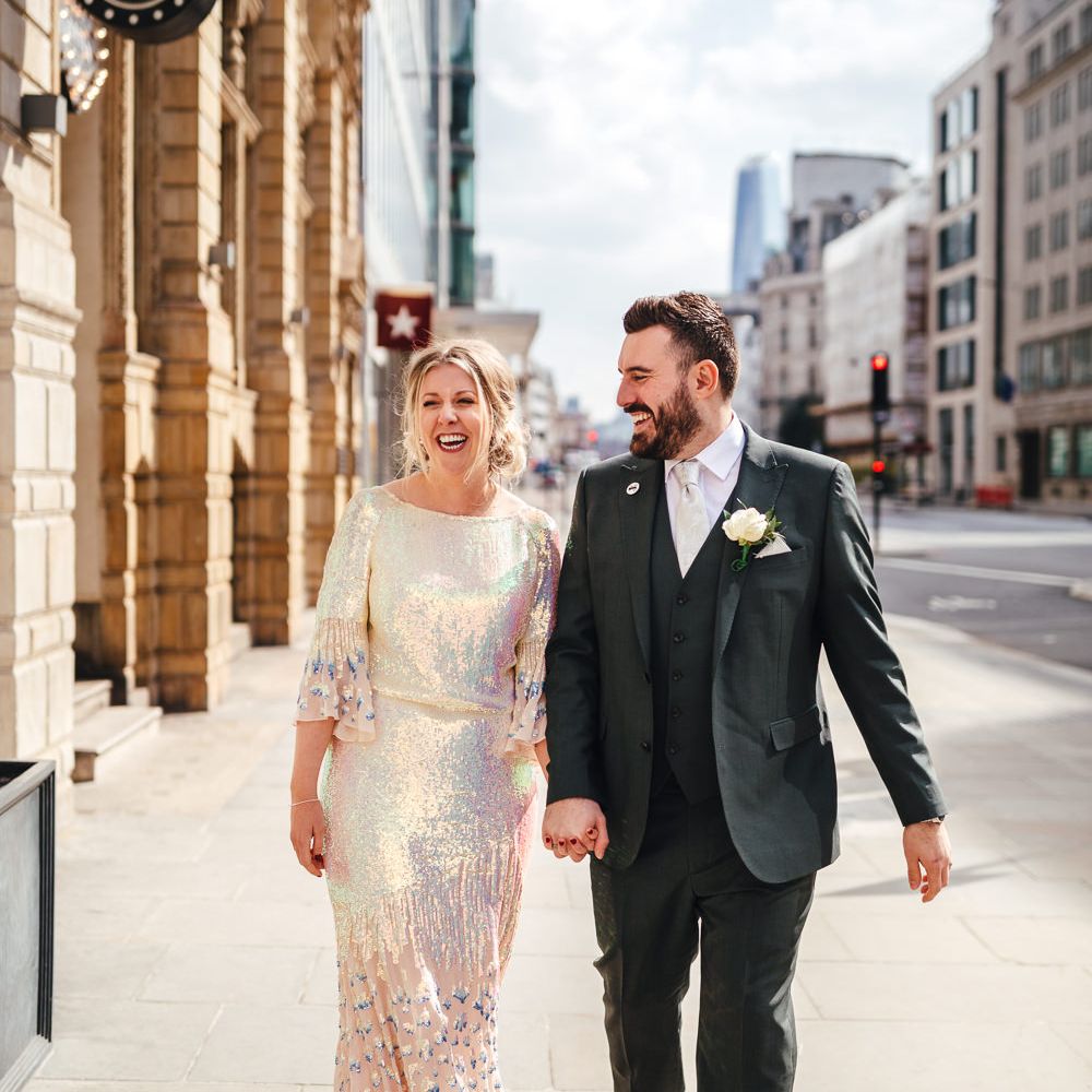Bride & groom walk together in London