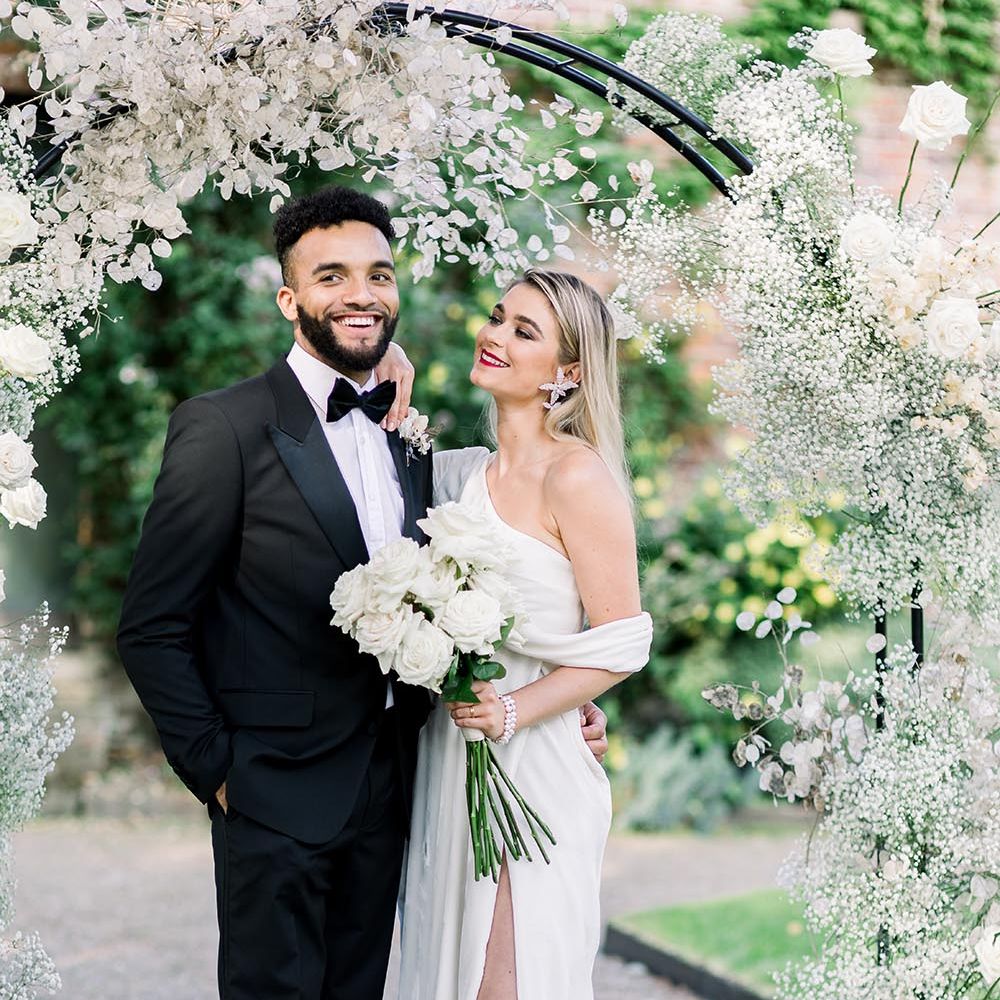 Summer wedding inspiration at Garthmyl Hall wedding venue with black tie suit and wrap wedding dress