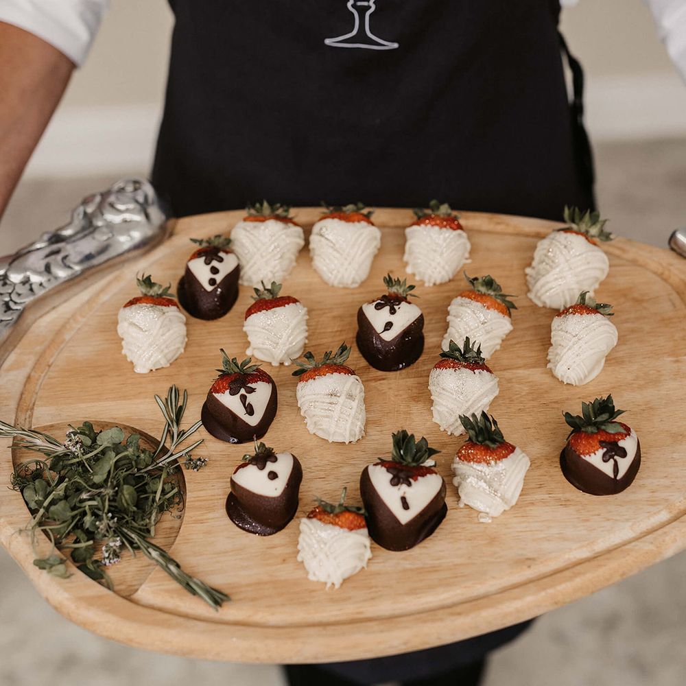 Touchays wedding catering with chocolate covered strawberries on wooden board