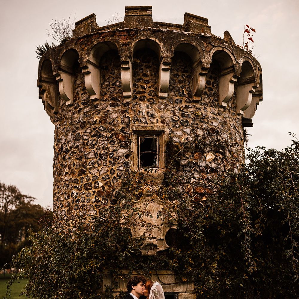 Bride and groom kiss at Oxnead Hall wedding venue