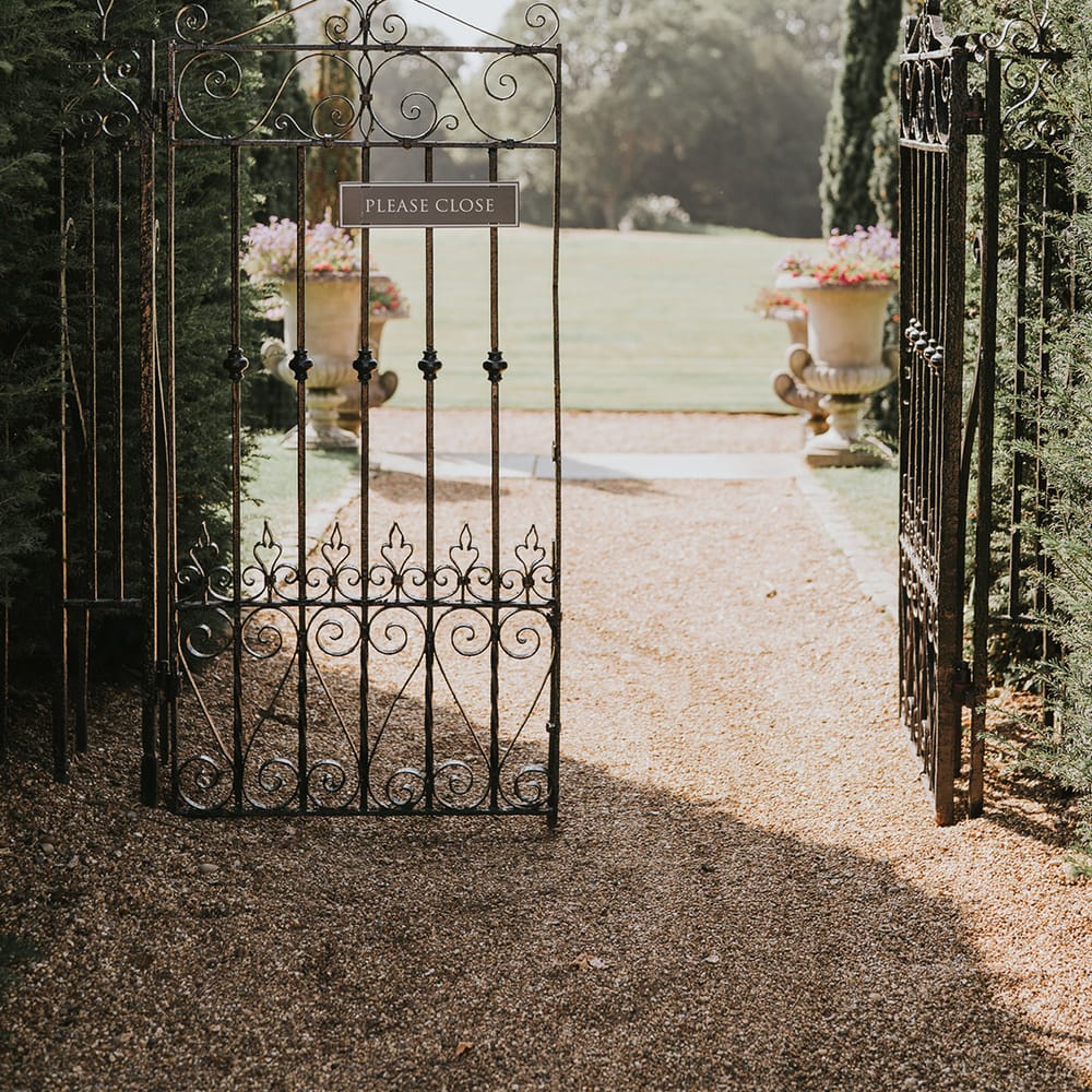 Black iron gate entrance to Hedsor House wedding venue 