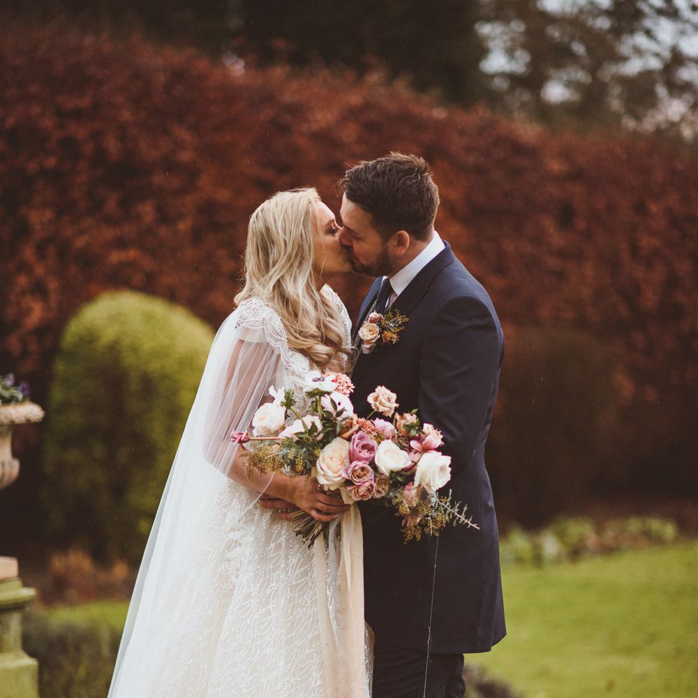 Bride and groom portrait in the grounds at Goldsborough Hall wedding