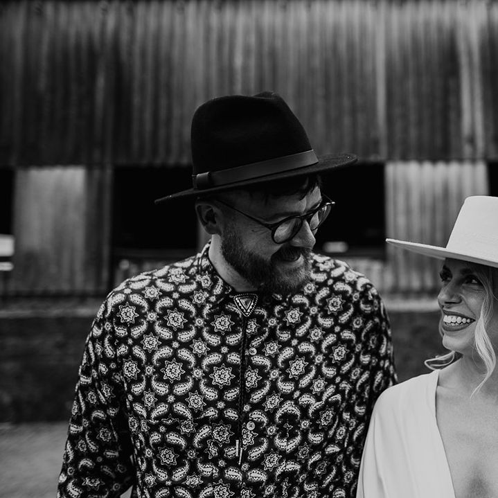 Black & white image of bride and groom with one another on their wedding day