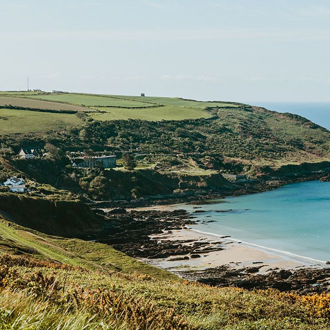 Beach front for Cornwall wedding with pink starry wedding dress and DIY aspects throughout