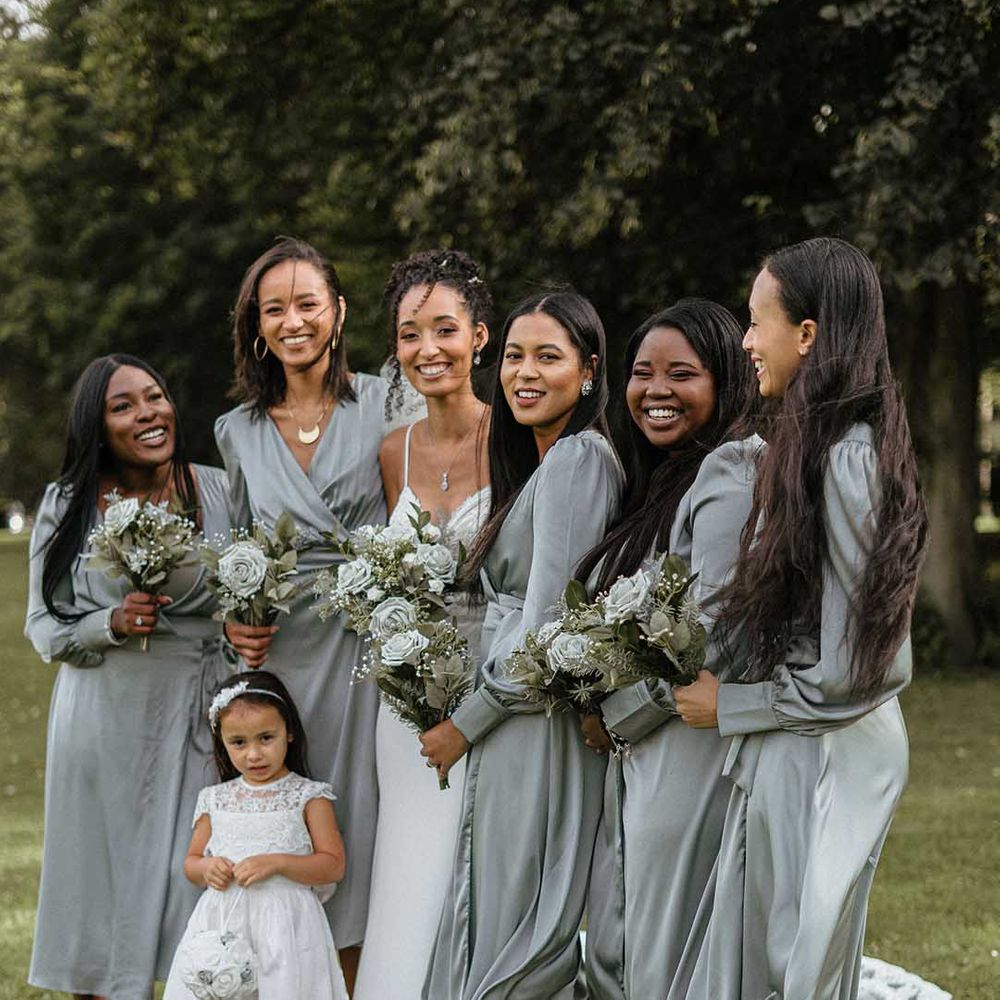Bridal party wearing wrap front long sleeve midi grey bridesmaid dresses 