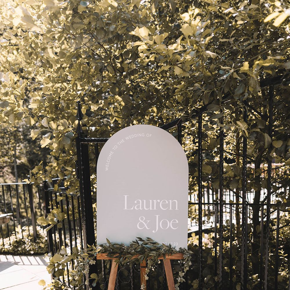 Neutral arched wedding welcome sign 