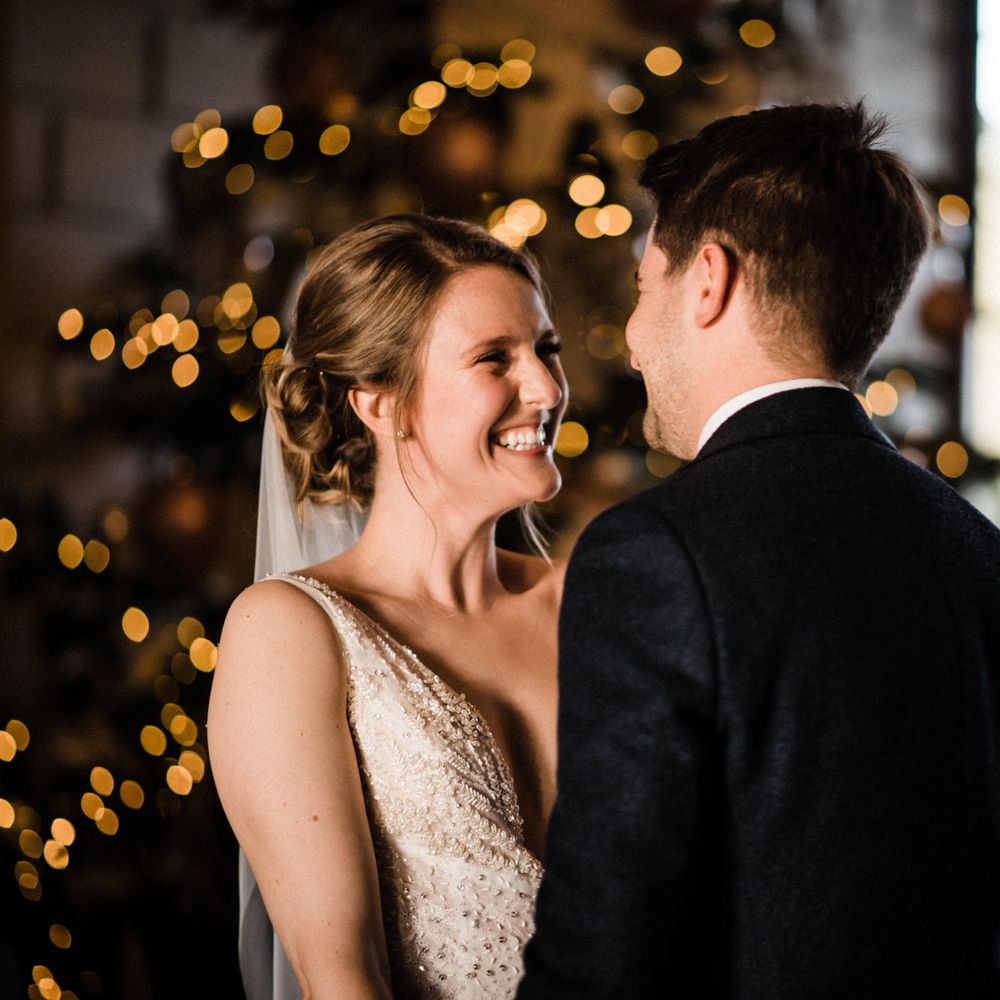 Bride & groom pose for post wedding pictures