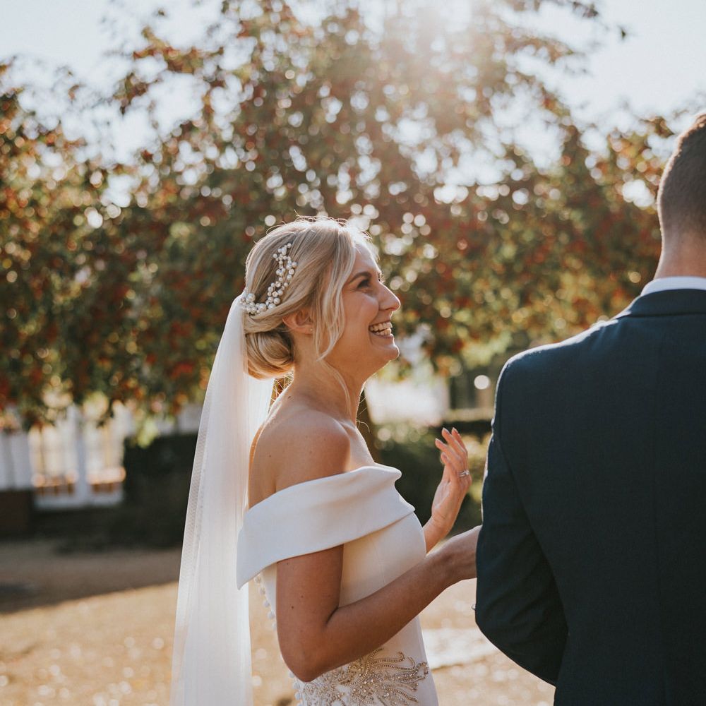 Bride laughs in the sunshine 